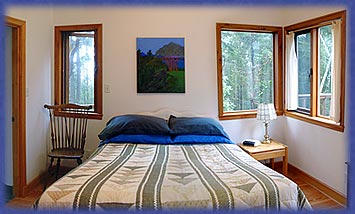a fish-eye-lens view of the bedroom of Cufra Cottage, Thetis Island, BC